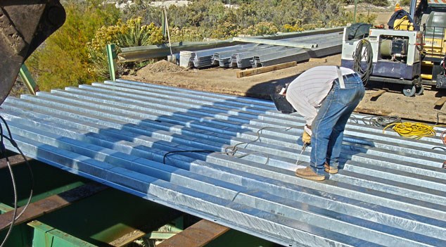 Installing steel bridge plank