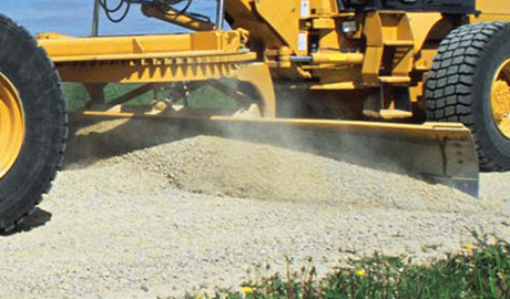 Grader blade in use